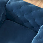 Fauteuil club Chesterfield en velours capitonné avec pieds en L chromés
